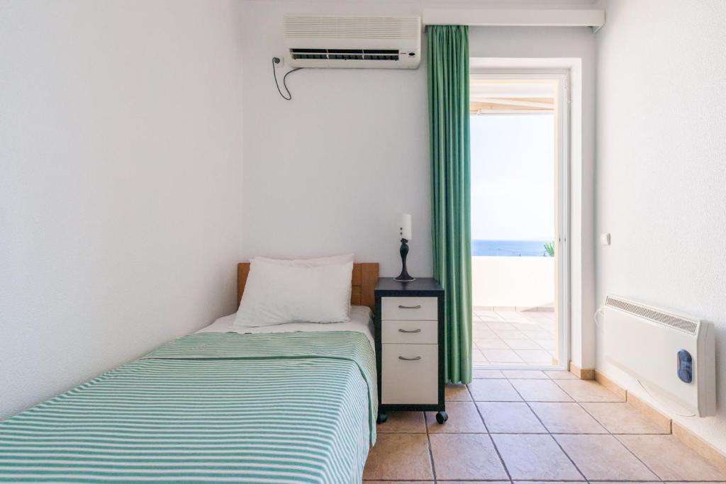A bed or beds in a room at Villa Adamite