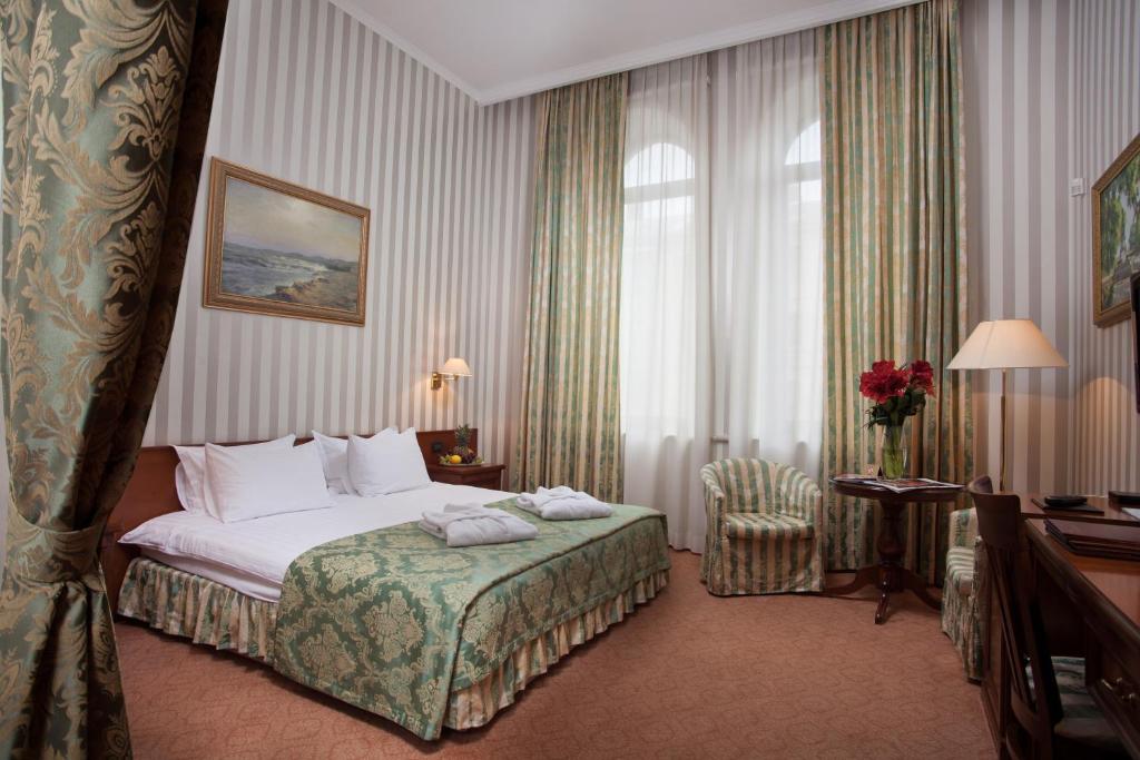 Postel nebo postele na pokoji v ubytování Hotel Otrada