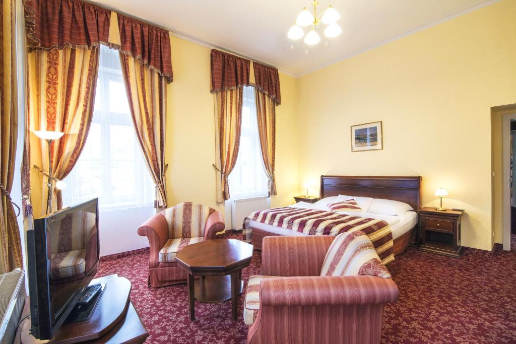 Posteľ alebo postele v izbe v ubytovaní Hotel Ontario