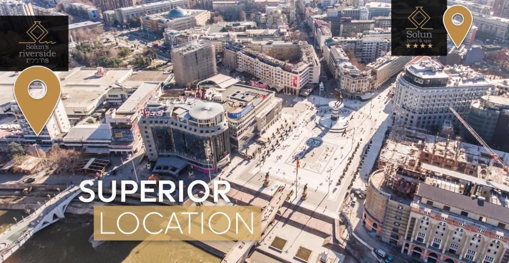 an aerial view of a city with the words superior location at Solun's Riverside Rooms in Skopje