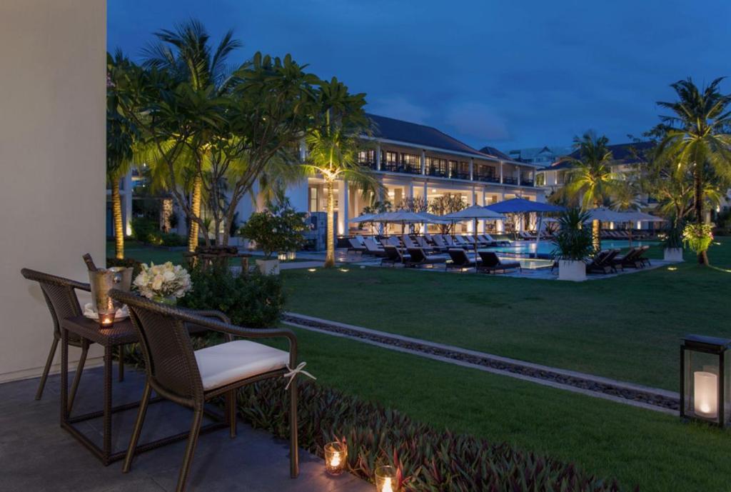 An evening garden terrace overlooking the resort pool.