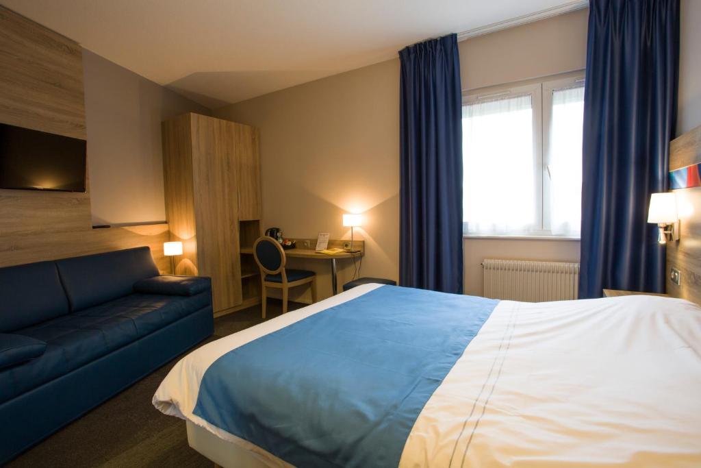 Postel nebo postele na pokoji v ubytování Hotel Restaurant Le Coquelicot
