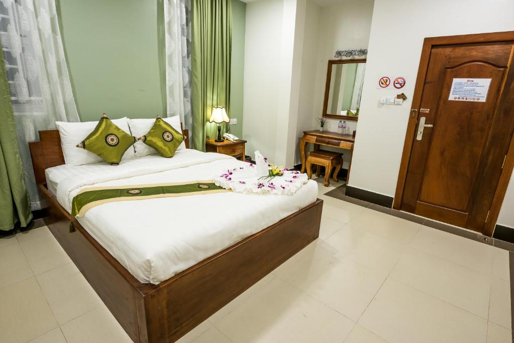 Postel nebo postele na pokoji v ubytování NKS Hotel