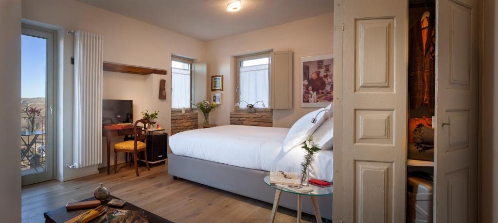 Postel nebo postele na pokoji v ubytování Borgese Camere e Suites