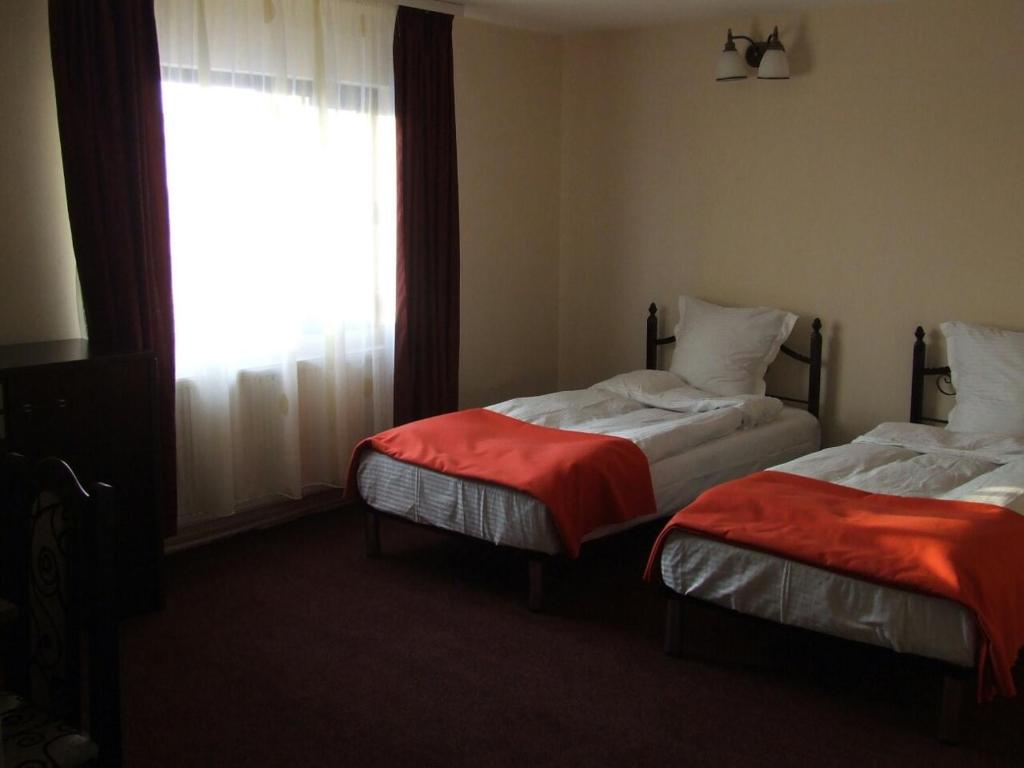 Un pat sau paturi într-o cameră la Pensiunea Hanami