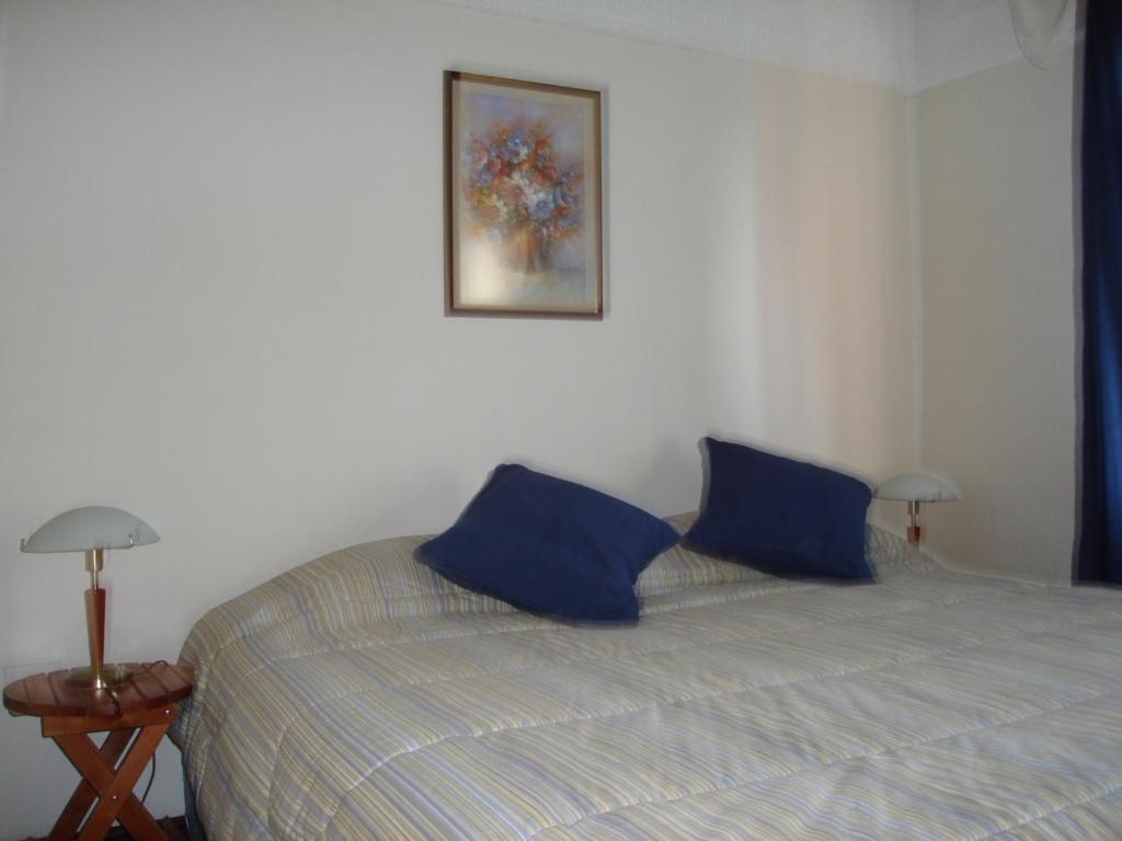 Postel nebo postele na pokoji v ubytování Apart Hotel Punto Real