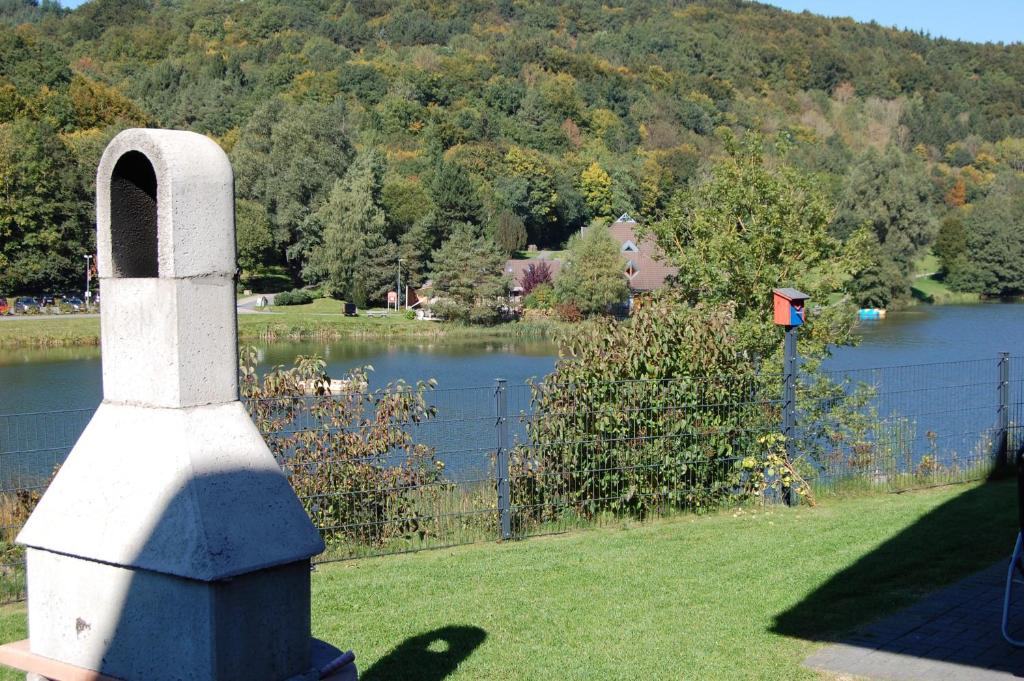 a view of a body of water with a fence at Traumhaus am See in Rieden