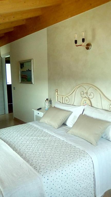 Postel nebo postele na pokoji v ubytování Art Gallery B&B Foresteria