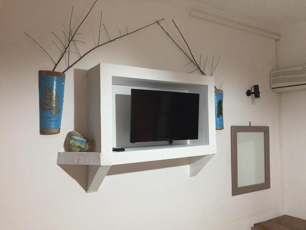 TV a/nebo společenská místnost v ubytování Gerani