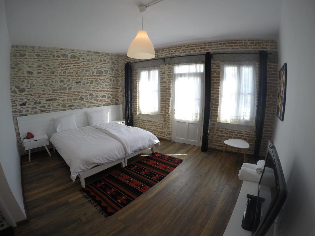 Ένα ή περισσότερα κρεβάτια σε δωμάτιο στο Old Bazaar Rooms