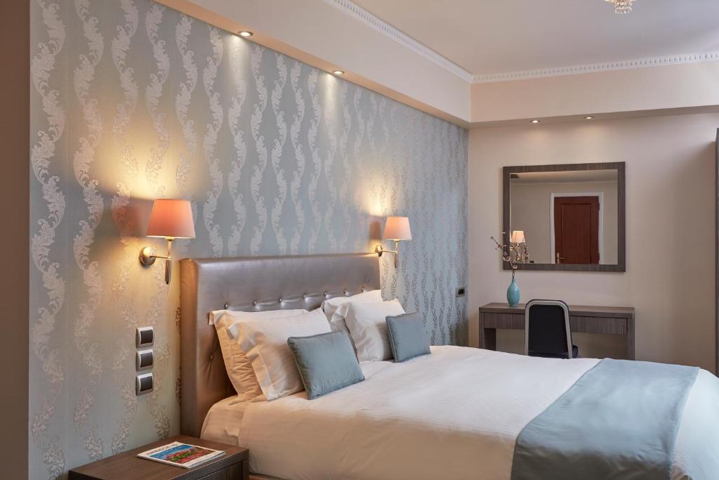 Postel nebo postele na pokoji v ubytování Ava Hotel and Suites
