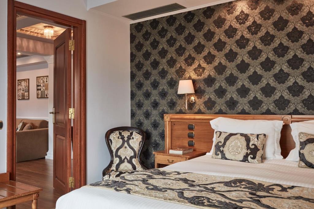 Postel nebo postele na pokoji v ubytování Ava Hotel and Suites