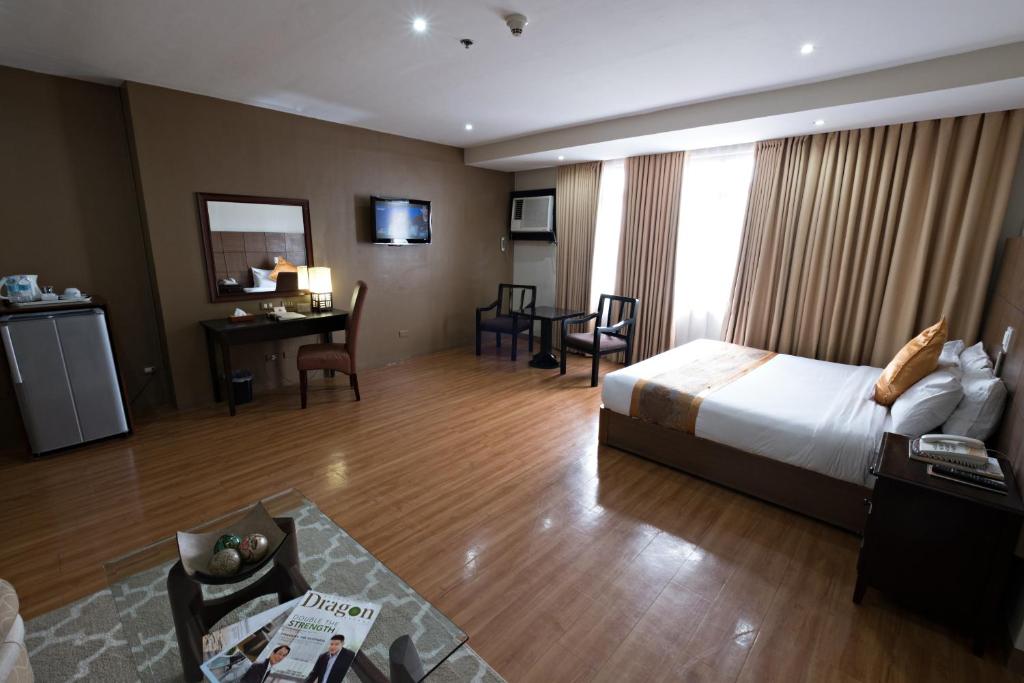Katil atau katil-katil dalam bilik di The Pinnacle Hotel and Suites