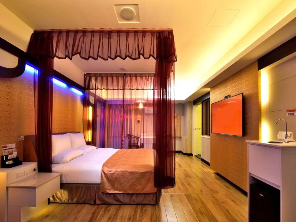Postel nebo postele na pokoji v ubytování M Garden Business Hotel