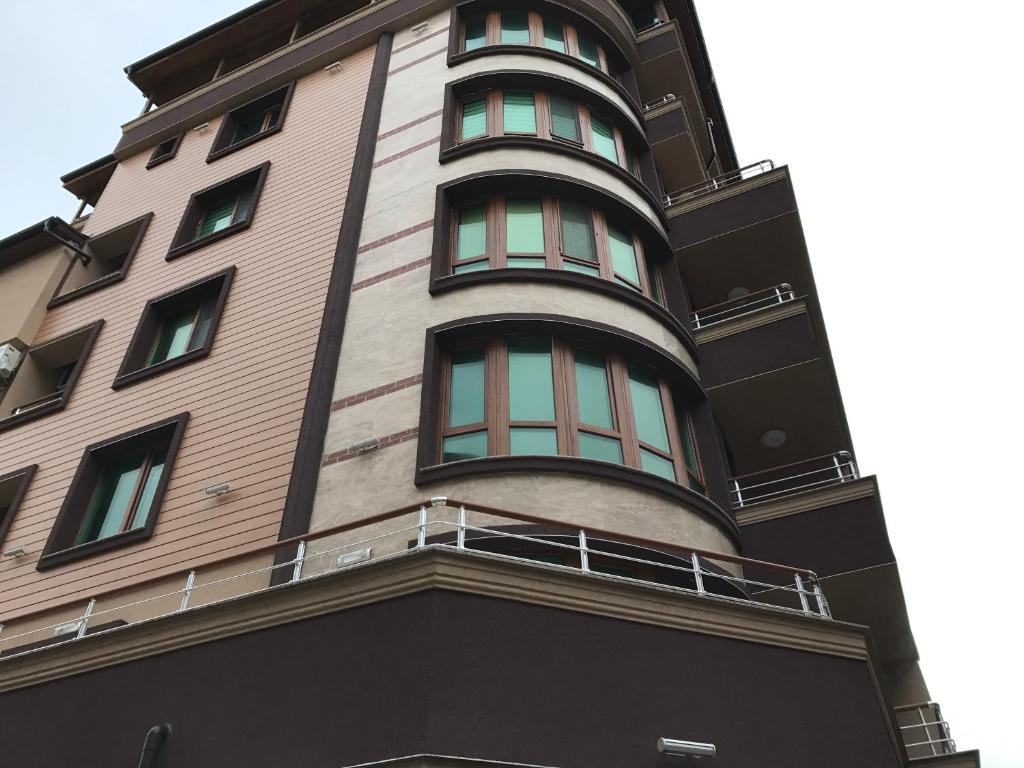 a tall building with windows on the side of it at Beach Apartments Pomorie in Pomorie