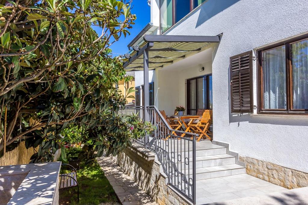 a house with stairs leading up to a house at Apartment VIVIANA in Pula