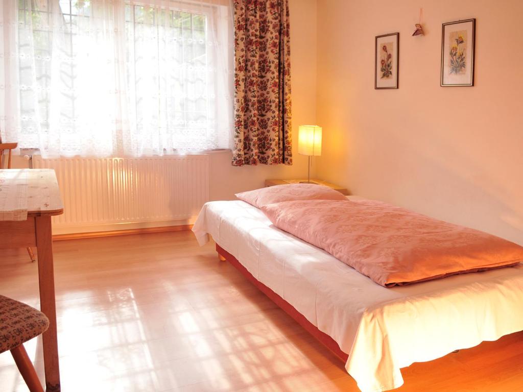 Postel nebo postele na pokoji v ubytování Haus Gilli