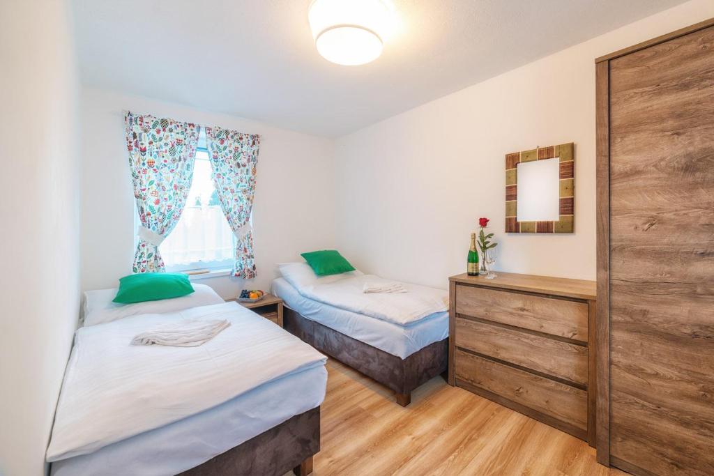 Postel nebo postele na pokoji v ubytování Chalet 3 Domky 182