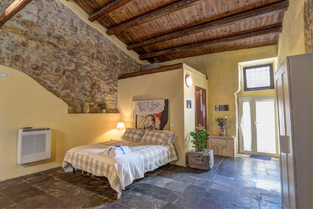 Postel nebo postele na pokoji v ubytování B&B Vico Manenti