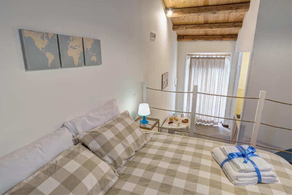 Postel nebo postele na pokoji v ubytování B&B Vico Manenti