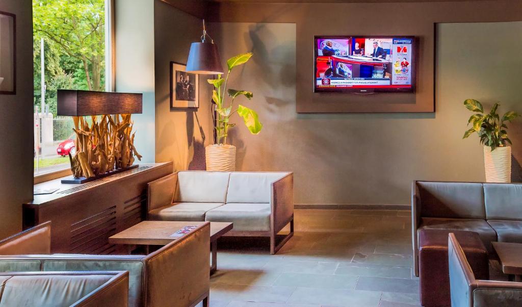 TV a/nebo společenská místnost v ubytování Hotel Stadtpalais