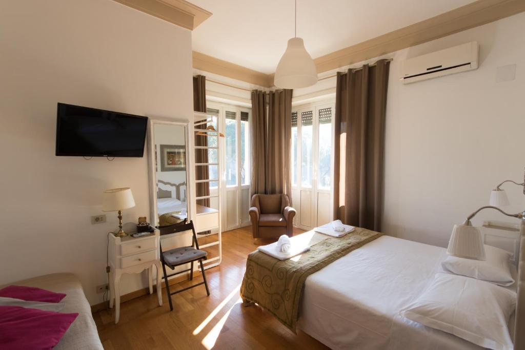 a hotel room with a bed and a chair at Flaminia - B&B Tevere Home "Bed your Breakfast" in Rome