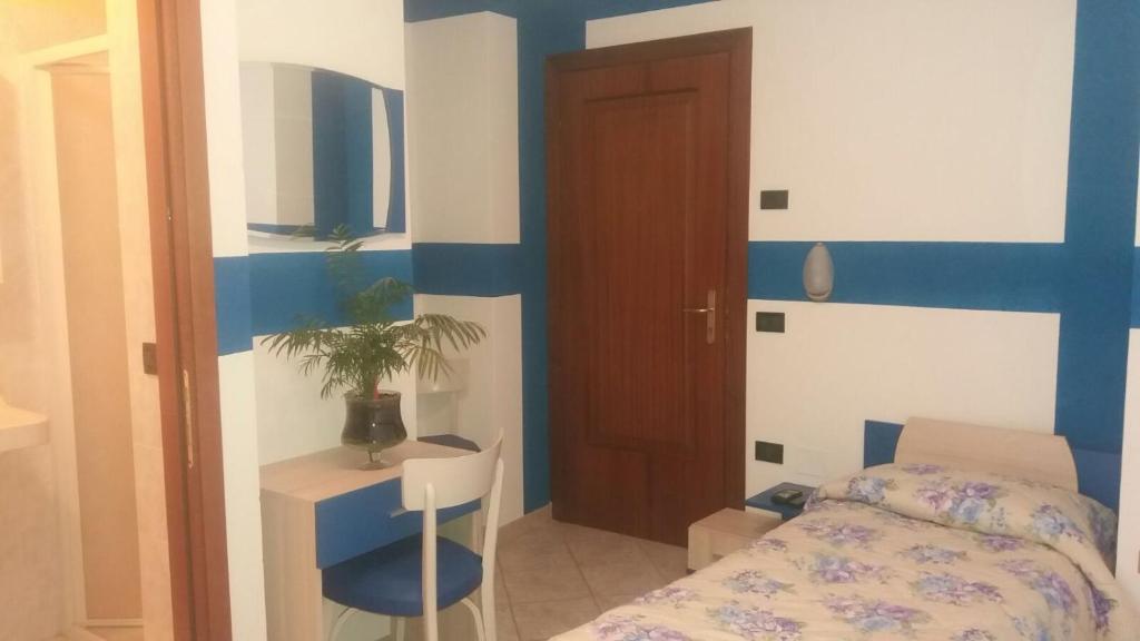 Postel nebo postele na pokoji v ubytování Albergo Belvedere
