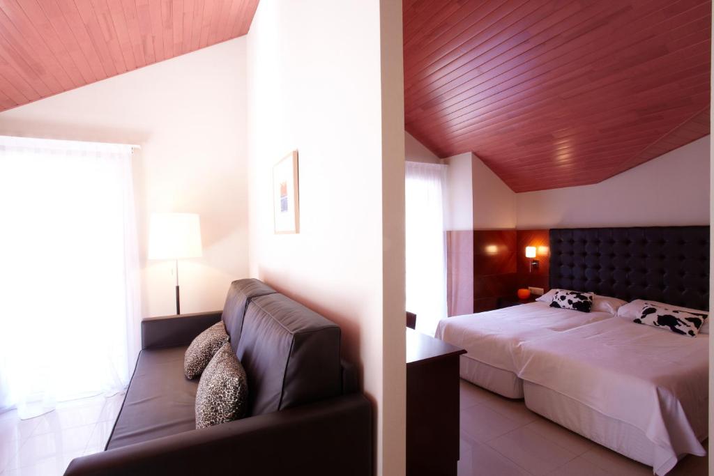 Кровать или кровати в номере Hotel MU & SPA