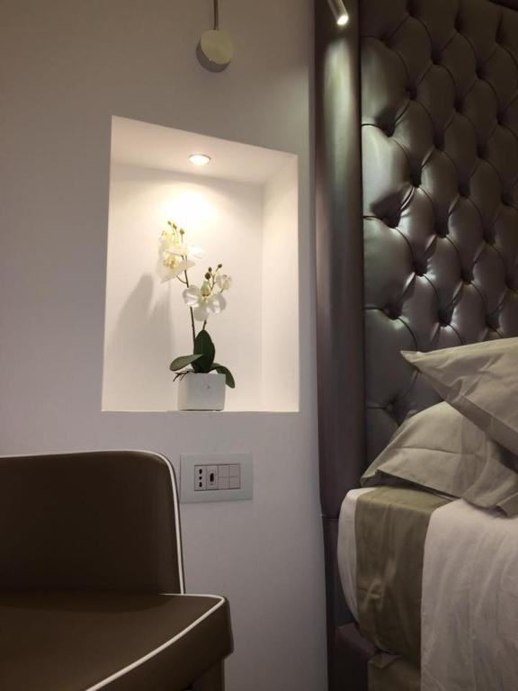 A bed or beds in a room at Antico Corso Charme