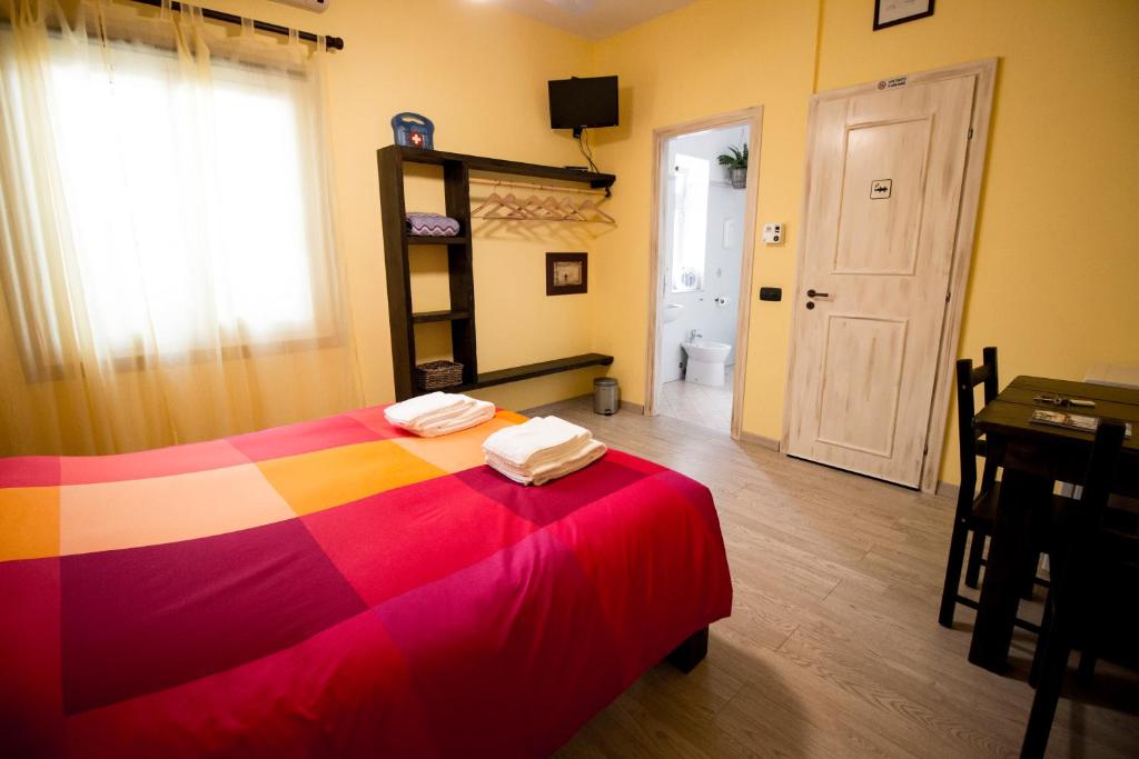 Postel nebo postele na pokoji v ubytování B&B San Leone