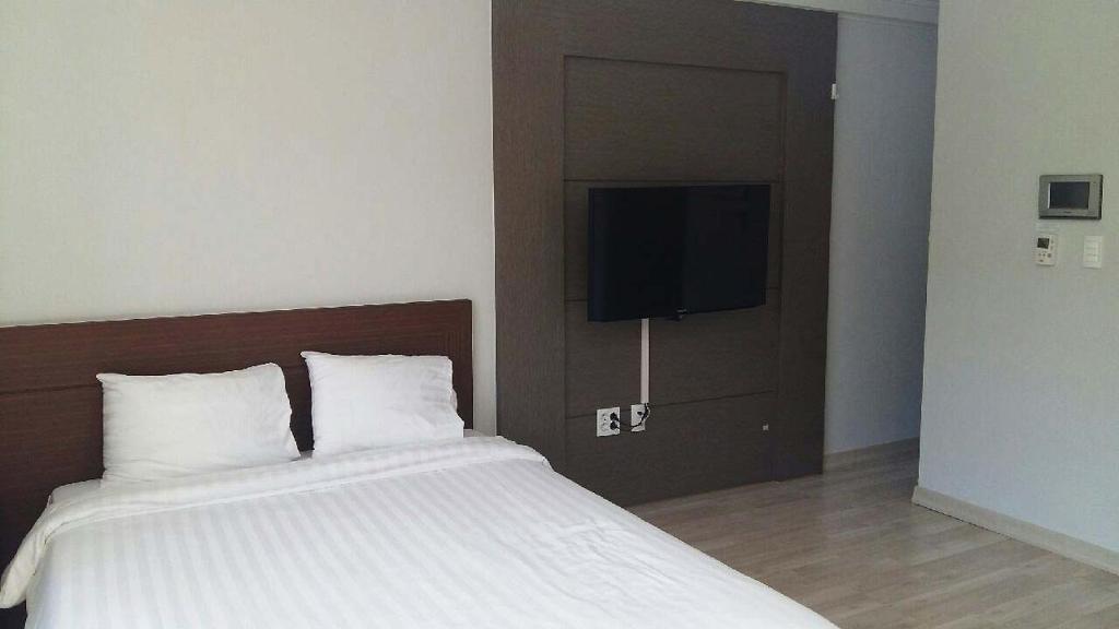 Postel nebo postele na pokoji v ubytování Gaon Residence Hotel
