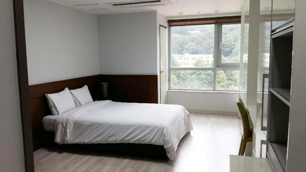 Postel nebo postele na pokoji v ubytování Gaon Residence Hotel