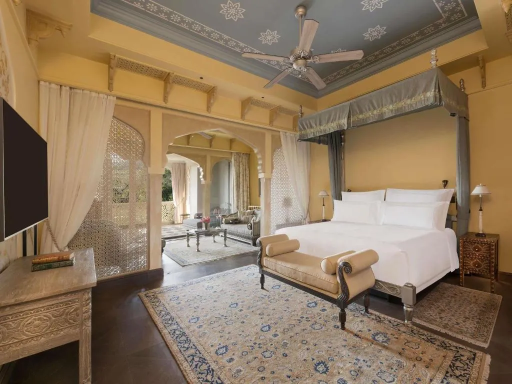 Junior Suite, King Bed with Balcony: Enjoy 20% savings on F&B, Spa and Laundry along with one Jaipur Sling Experience, with a spacious living area, luxurious bathroom and private balcony frame sweeping Aravalli views
