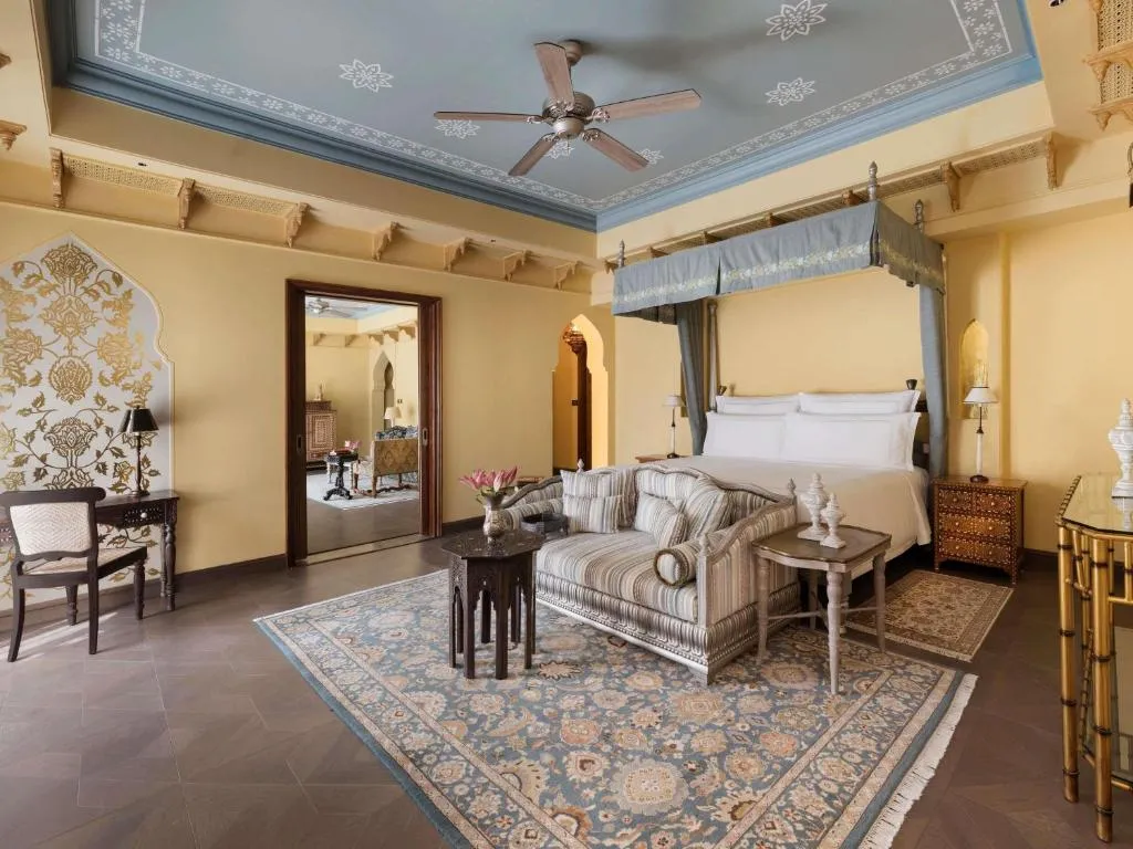 Maharani King Bedroom Suite with Pool: Enjoy 20% savings on F&B, Spa & Laundry, two-way airport transfer, one Jaipur Sling & Mineral Pool Experience, 01 bottle of wine, and Afternoon Tea Experience. Suite features Mughal-inspired interiors, private pool