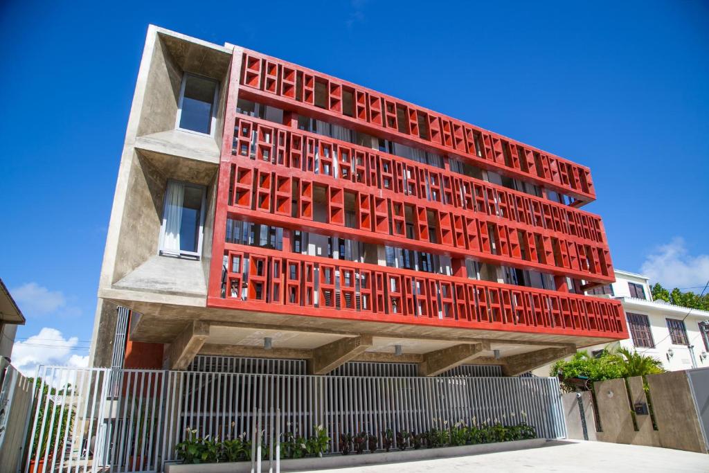 a building with a red facade at Dream Inn PR in San Juan