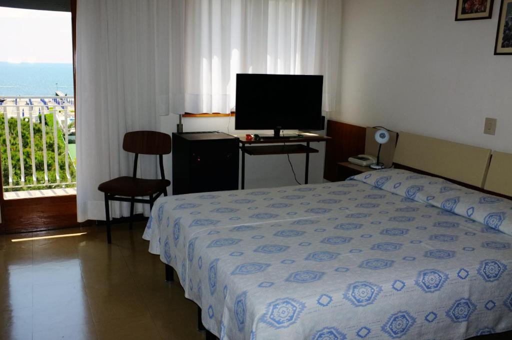 Postel nebo postele na pokoji v ubytování Hotel Reno
