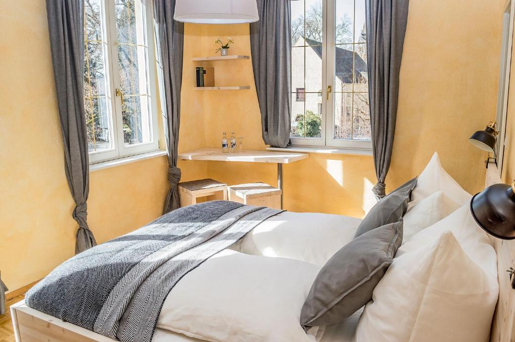 Postel nebo postele na pokoji v ubytování K-Hotel (Grüner Baum)