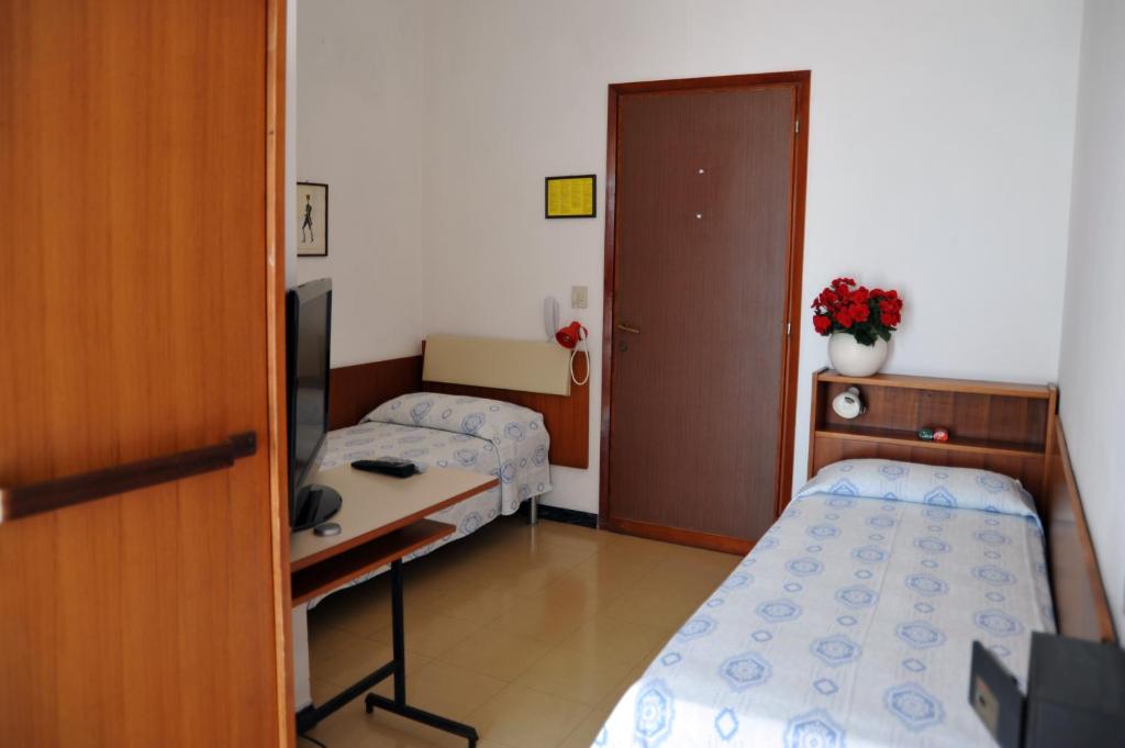 Postel nebo postele na pokoji v ubytování Hotel Reno
