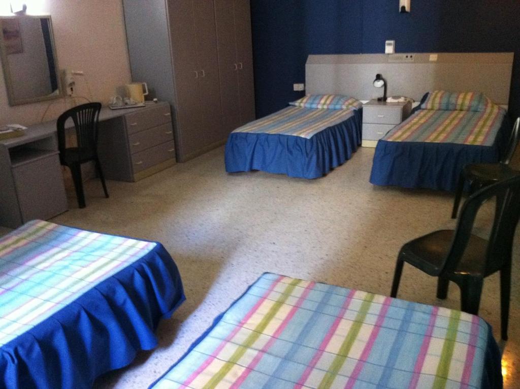 Postel nebo postele na pokoji v ubytování Roma Hotel