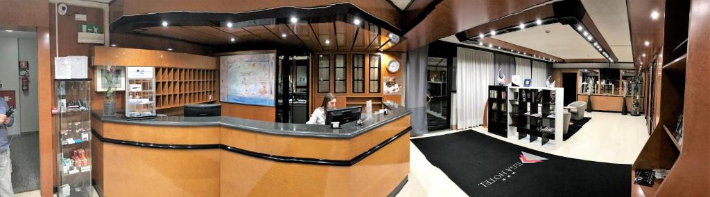 Telewizja i/lub zestaw kina domowego w obiekcie Ilga Hotel