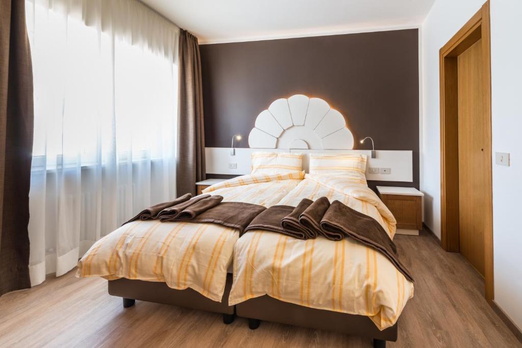 Postel nebo postele na pokoji v ubytování Hotel Paradiso