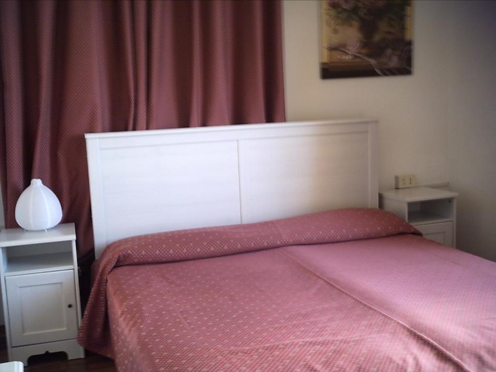 Postel nebo postele na pokoji v ubytování Hotel Eden Gigli