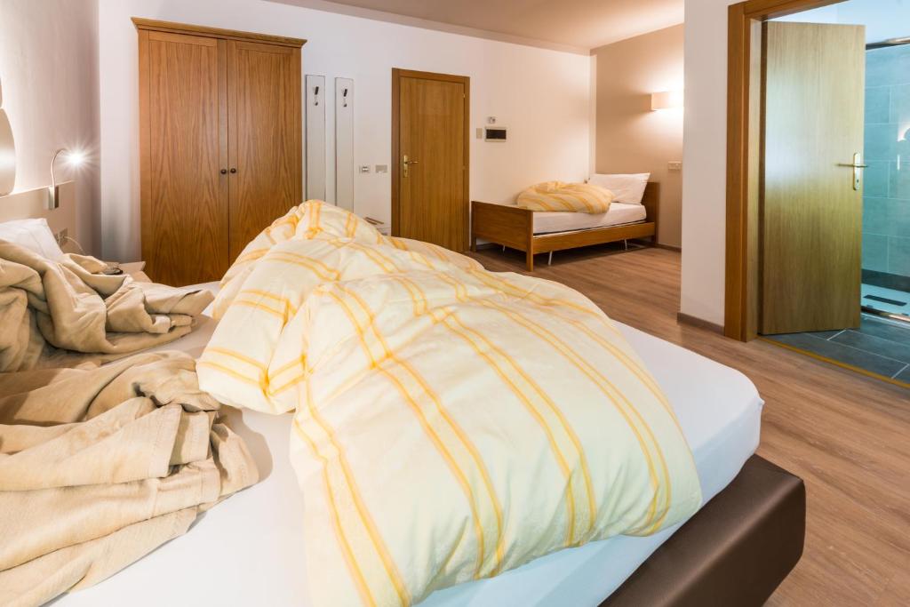 Postel nebo postele na pokoji v ubytování Hotel Paradiso