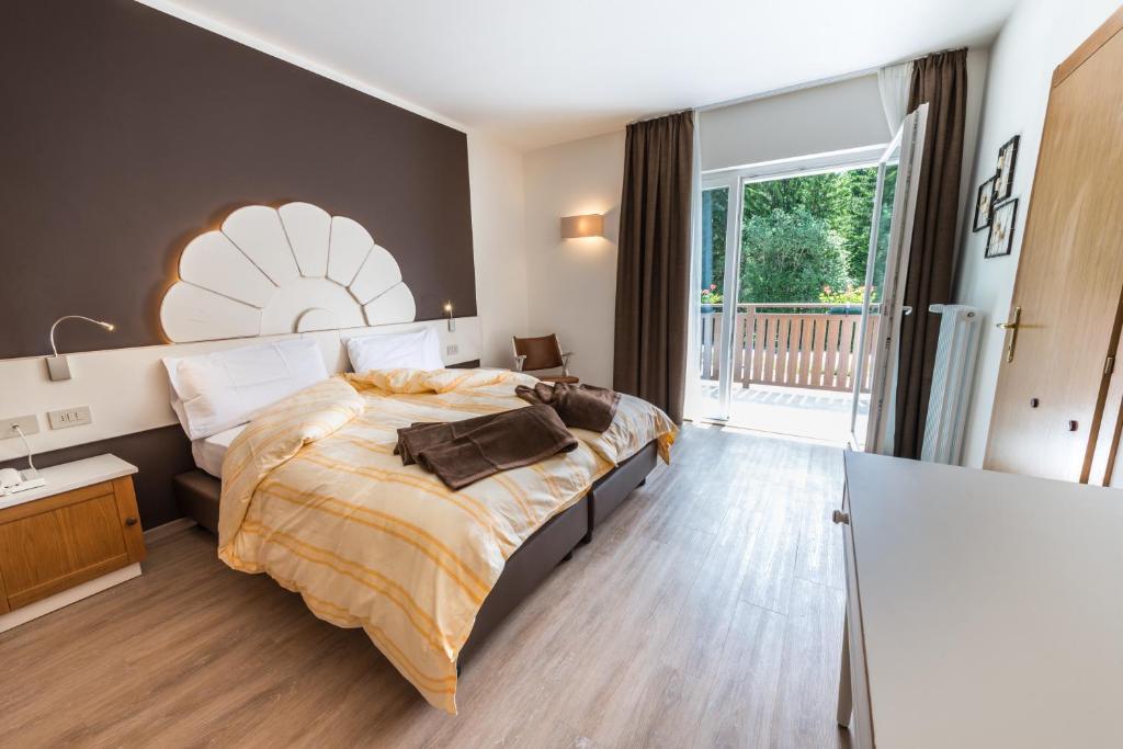 Postel nebo postele na pokoji v ubytování Hotel Paradiso