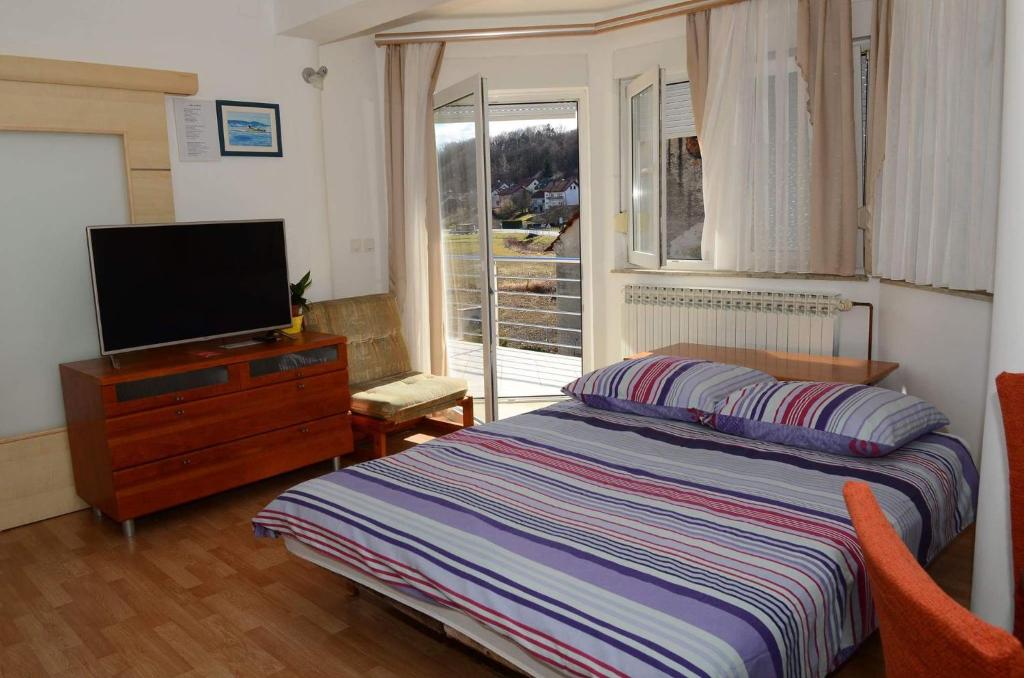 Кровать или кровати в номере Apartments Villa Split