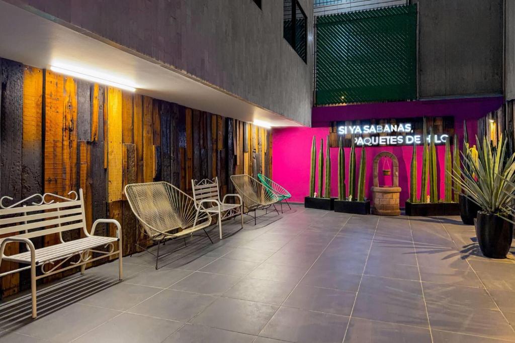 The courtyard seating area shown in evening lighting.