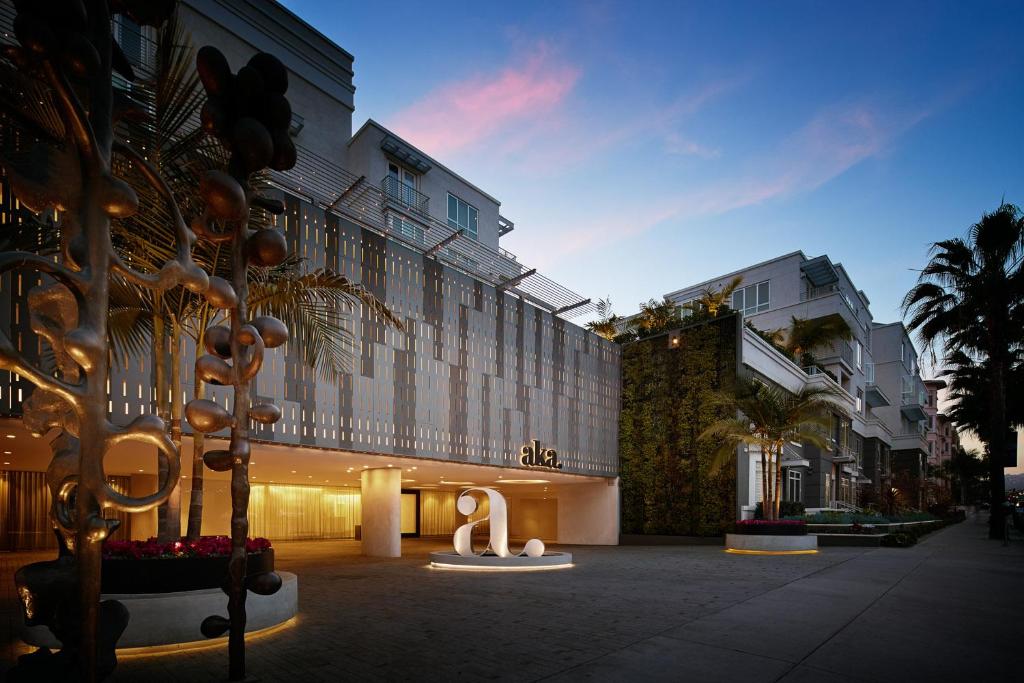 a building with a sculpture in front of it at AKA Beverly Hills in Los Angeles