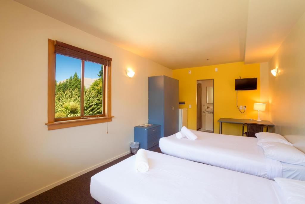 Postel nebo postele na pokoji v ubytování Reavers Lodge