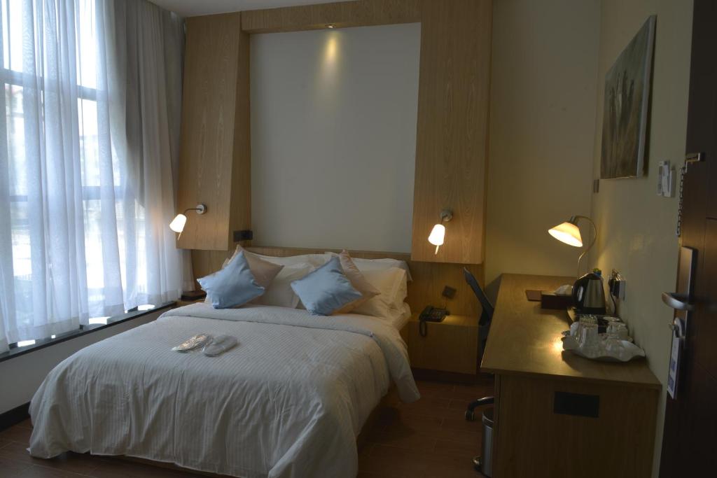 Postel nebo postele na pokoji v ubytování La Maison Royale