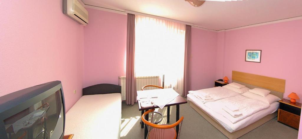 Postel nebo postele na pokoji v ubytování Apollo Motel